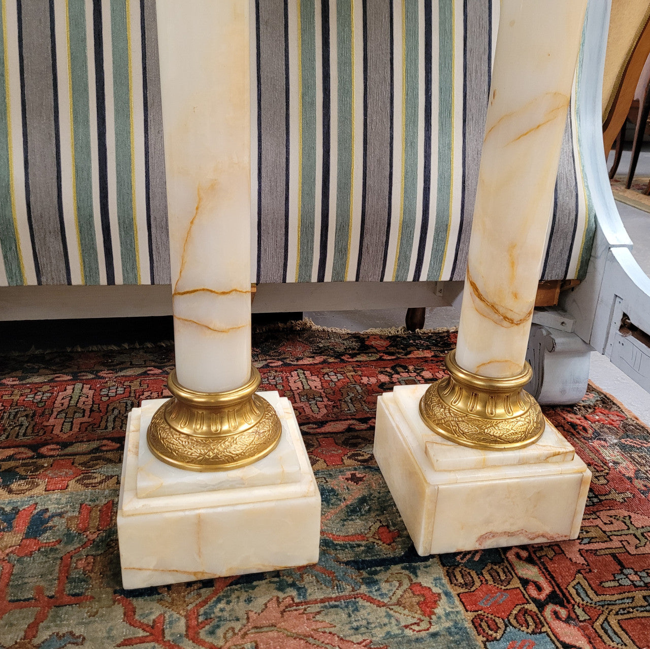 Pair of Imposing French alabaster marble and bronze pedestals. They are highly decorative and have been sourced from France. They are in good original detailed condition.