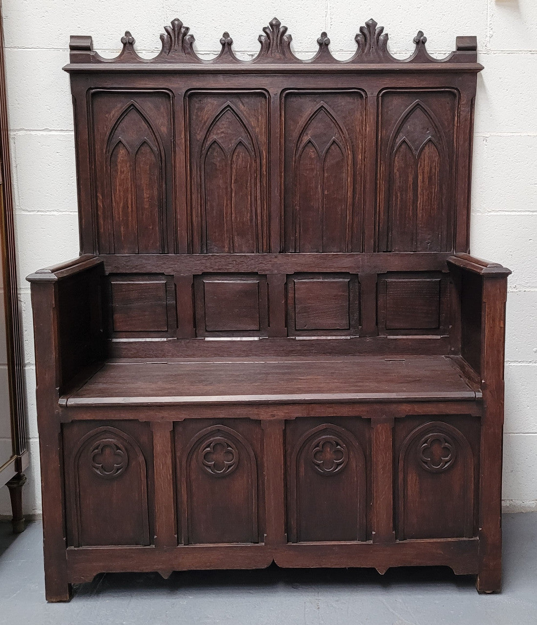 French Oak 19th Century gothic style high backed hall seat. Amazing detailed carving and is good detailed condition.
