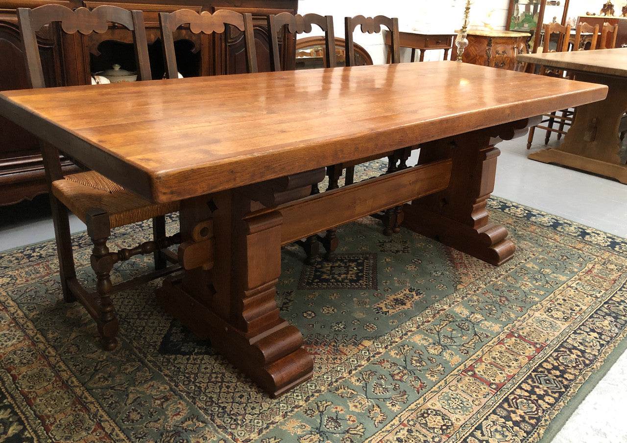 French Farmhouse table with a beautiful thick plank top and stretcher base. Can seat 8-10 people comfortably and is in good original detailed condition.