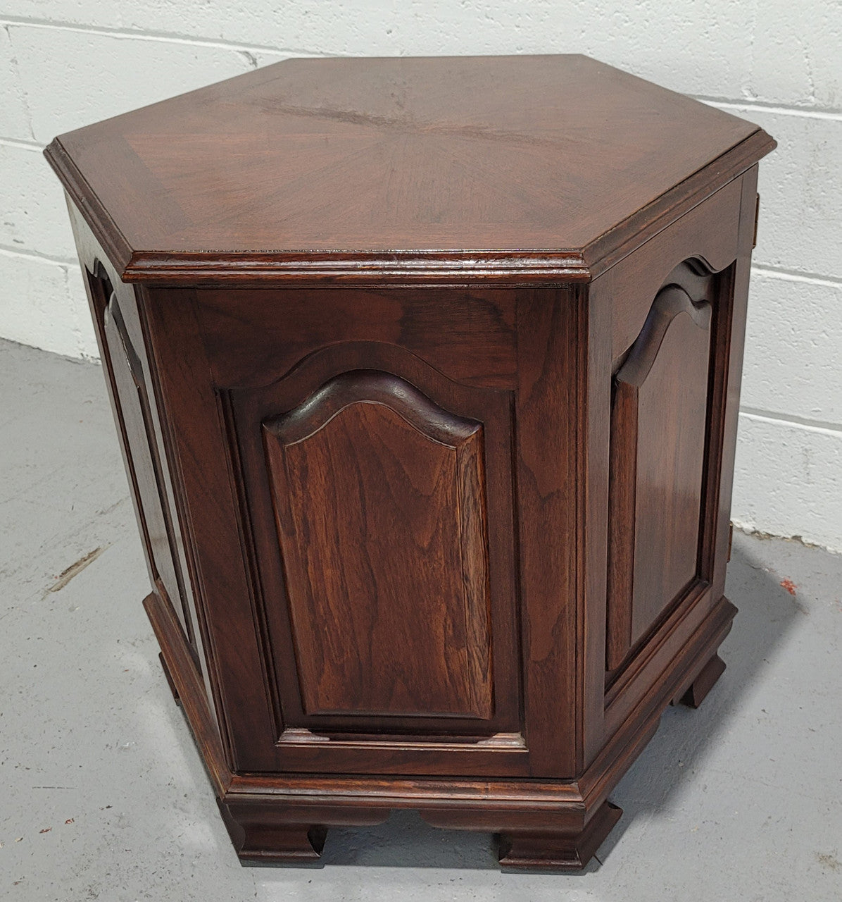 Hexagonal Mahogany enclosed side cabinet with two doors. Would make an ideal side cabinet and is in good restored condition.