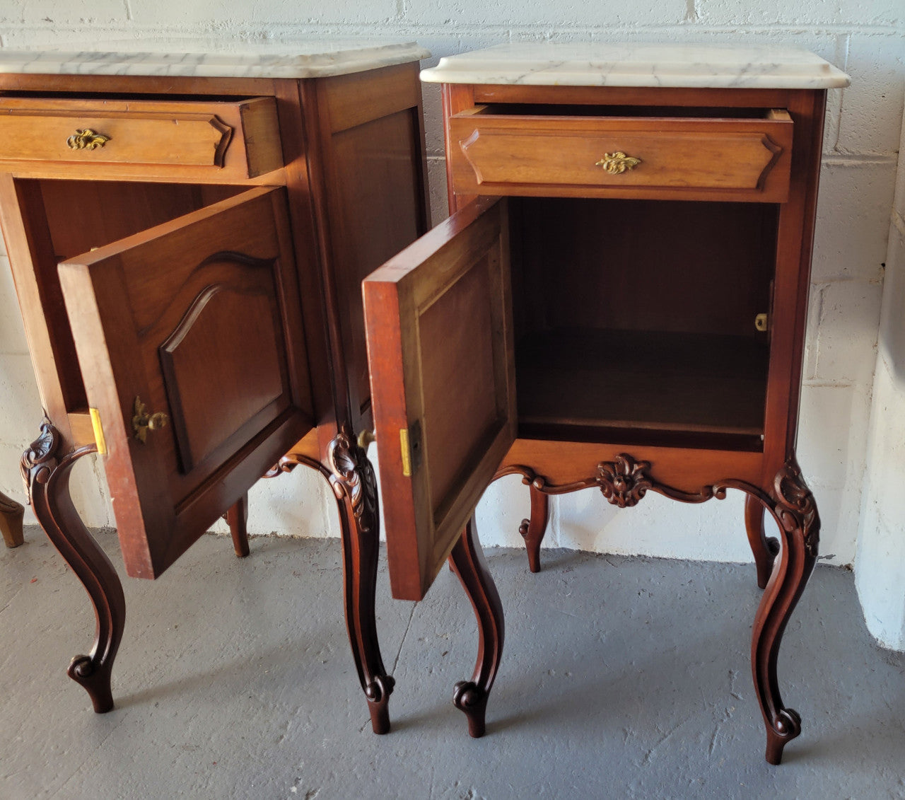Pair of Louis XV style Walnut bedside cabinets marble top. Circa 1900 and in good original detailed condition.