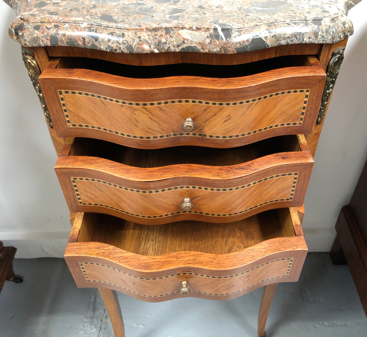 Single French commode marble top bedside with decorative inlay, ormolu mounts and a stunning coloured marble top.