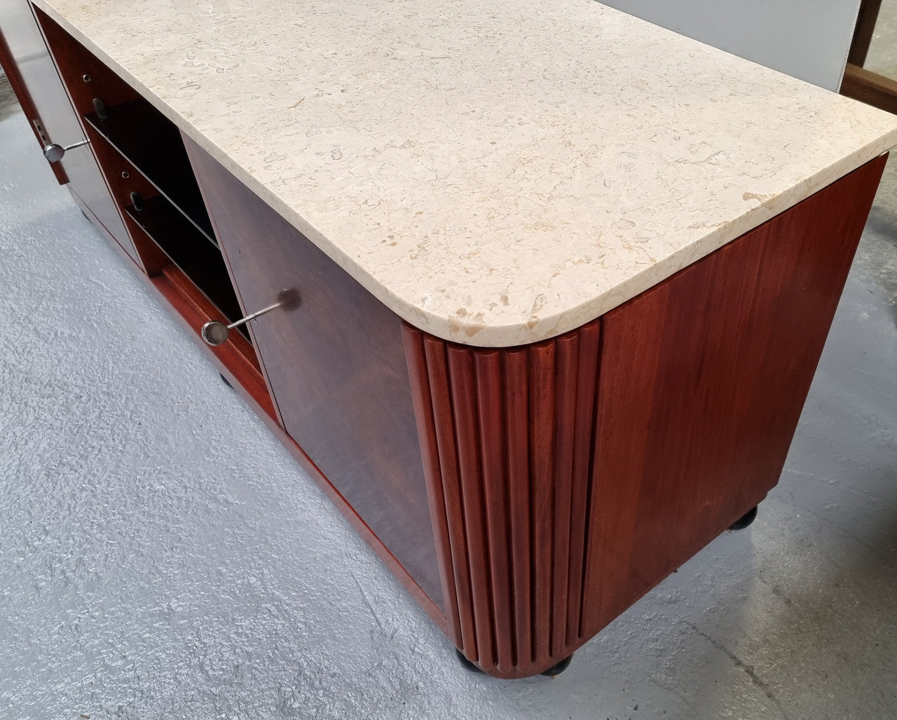 Beautiful Bespoke Art Deco style walnut and mahogany low line cabinet with a marble top and plenty of storage. It has two doors with a shelf each side and in the middle in has two glass shelves. Would make an ideal TV cabinet and has a hole in the back to run cords through. In very good original detailed condition.