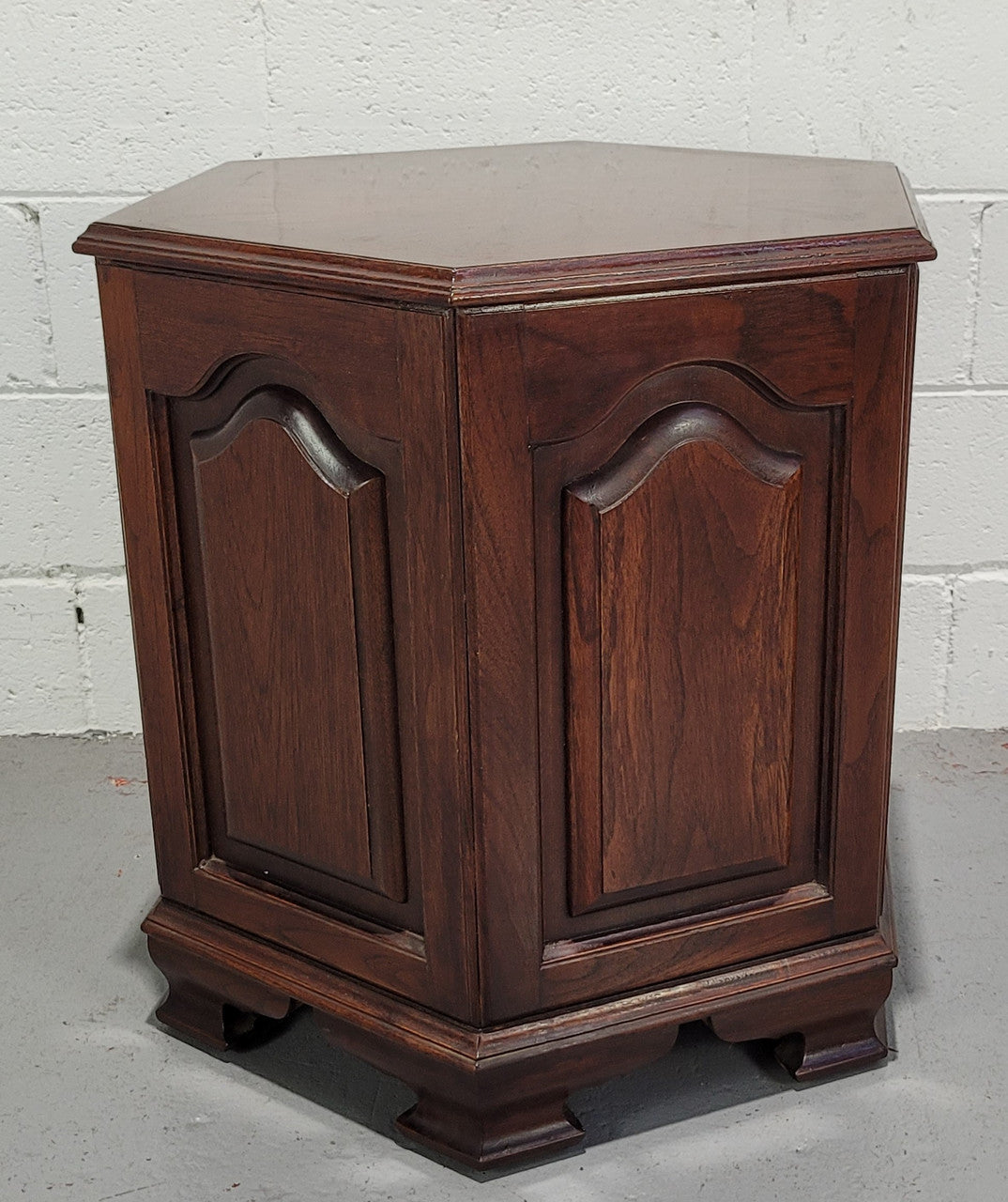 Hexagonal Mahogany enclosed side cabinet with two doors. Would make an ideal side cabinet and is in good restored condition.