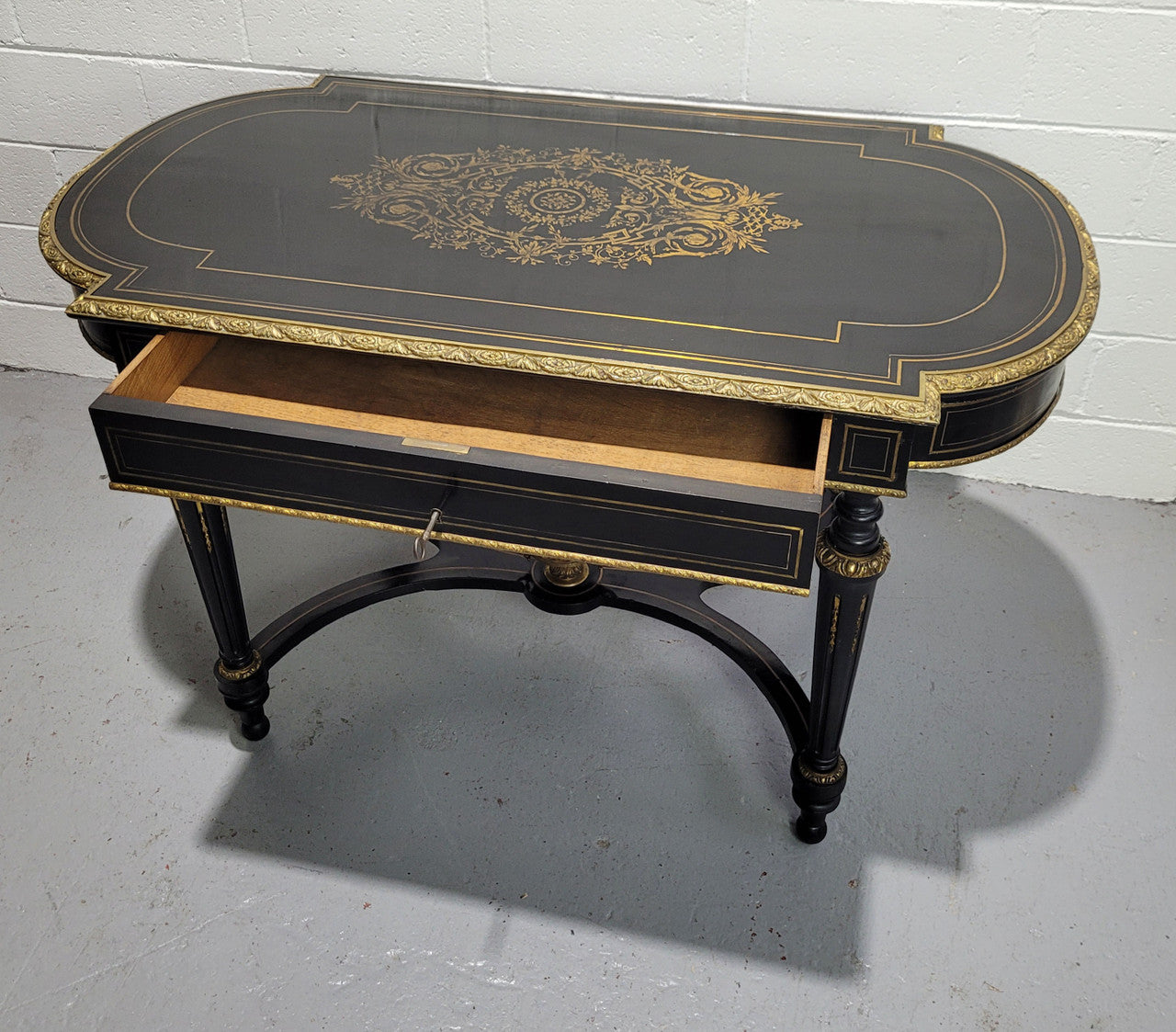 19th Century Napoleon III boulle ebonized centre table. Beautiful decorative mounts and has a drawer on one side. In good restored condition.