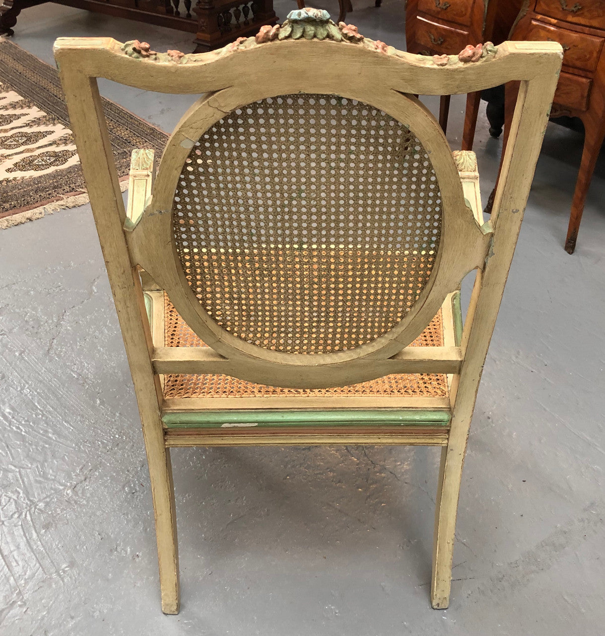 Painted French Louis XVI style cane panel arm chair. Paint is original and it is in very good original condition.