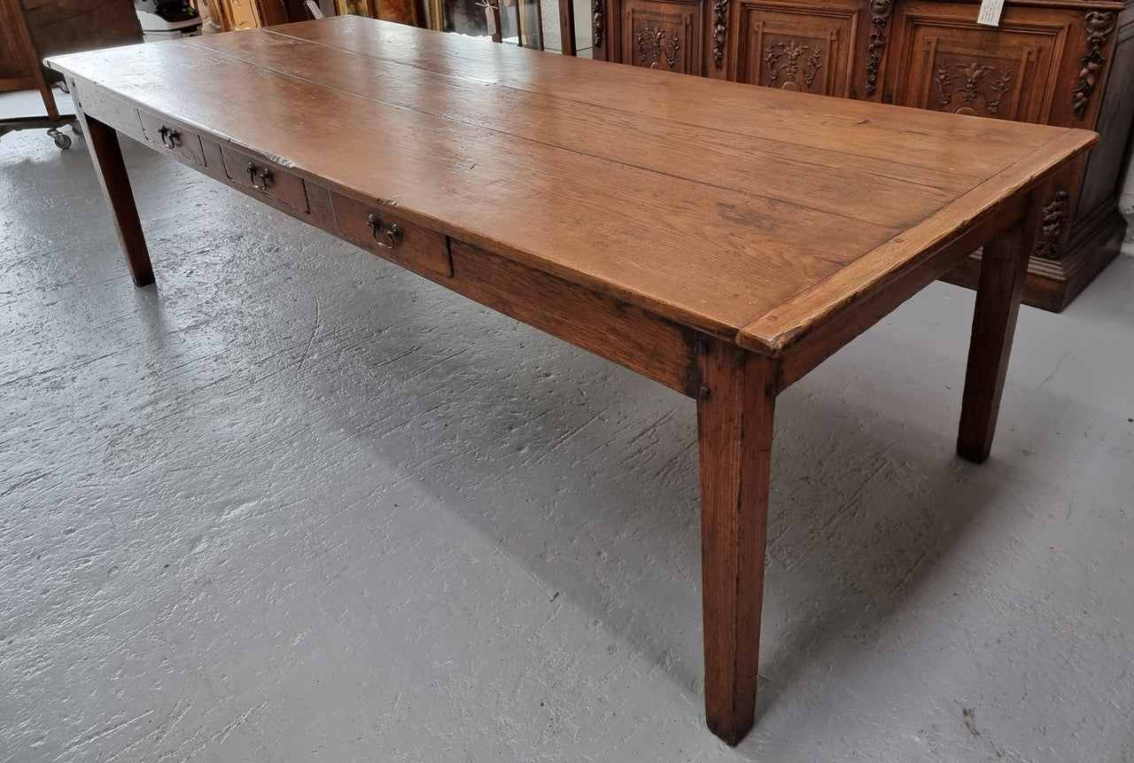 Amazing 19th Century French Oak Farmhouse Style Dining Table with three drawers. It is made from 3 large planks of wood which is very hard to find. 105.5 cm wide.