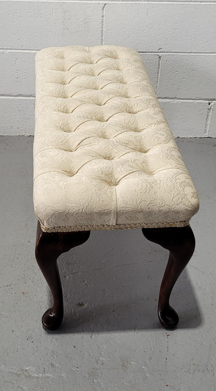 Vintage neutral upholstered buttoned stool. Fabric is in good used condition, please view photo's has they help form the description. The stool its self is in good condition.