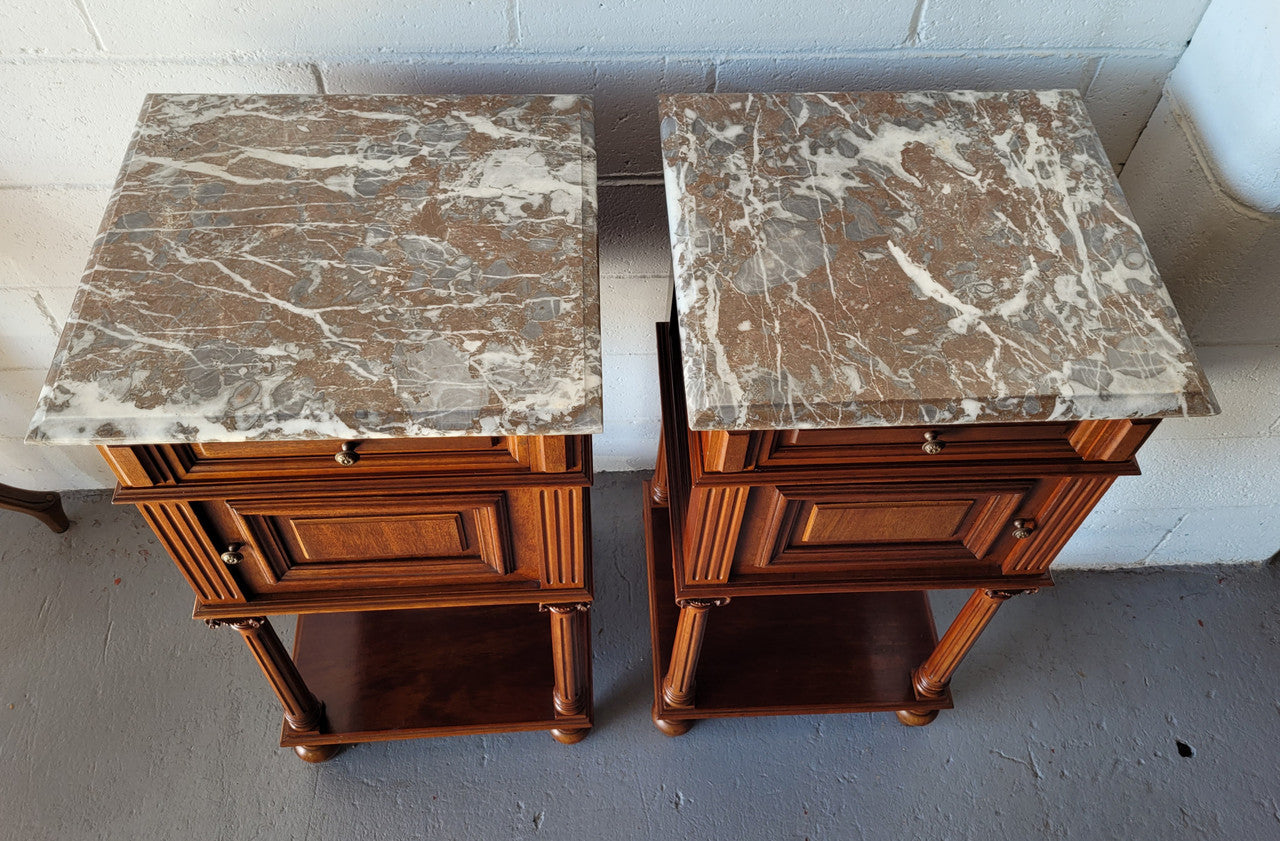 Pair of Henry II style Walnut bedside cabinets with a marble top. Circa 1920s and in good original condition.