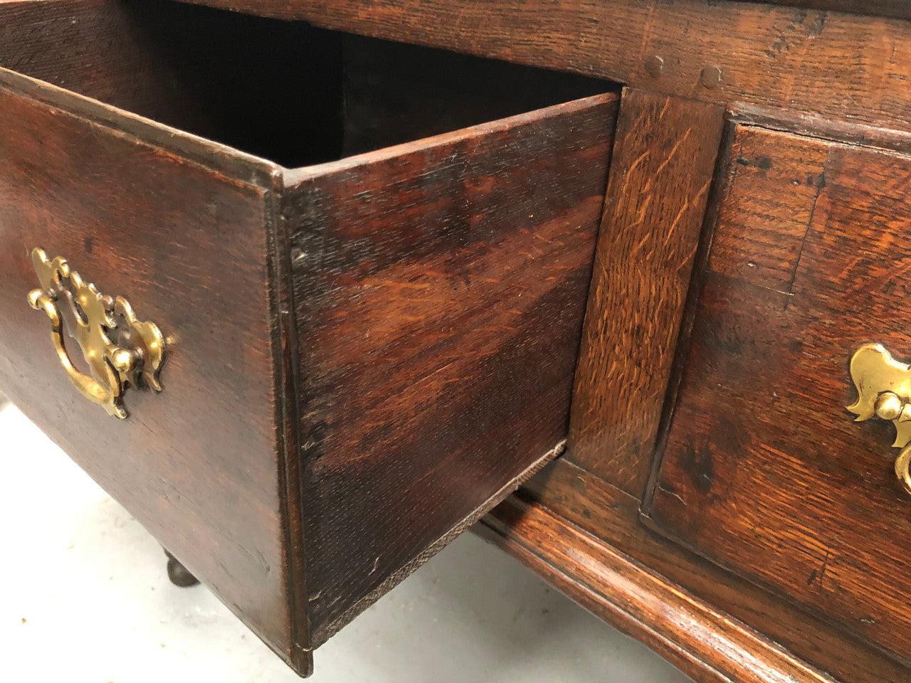 Early 19th Century English Oak dresser base with three large drawers. In very good original detailed condition.