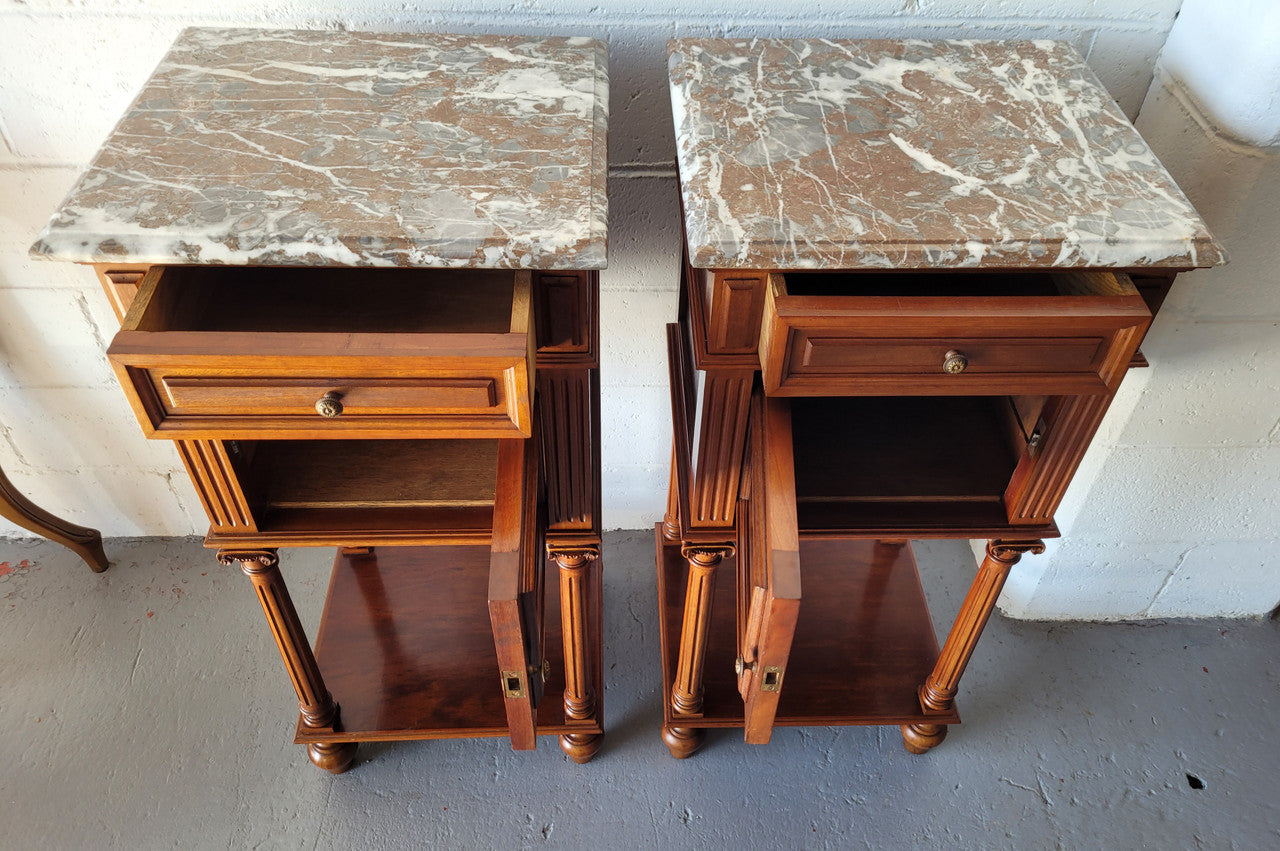 Pair of Henry II style Walnut bedside cabinets with a marble top. Circa 1920s and in good original condition.