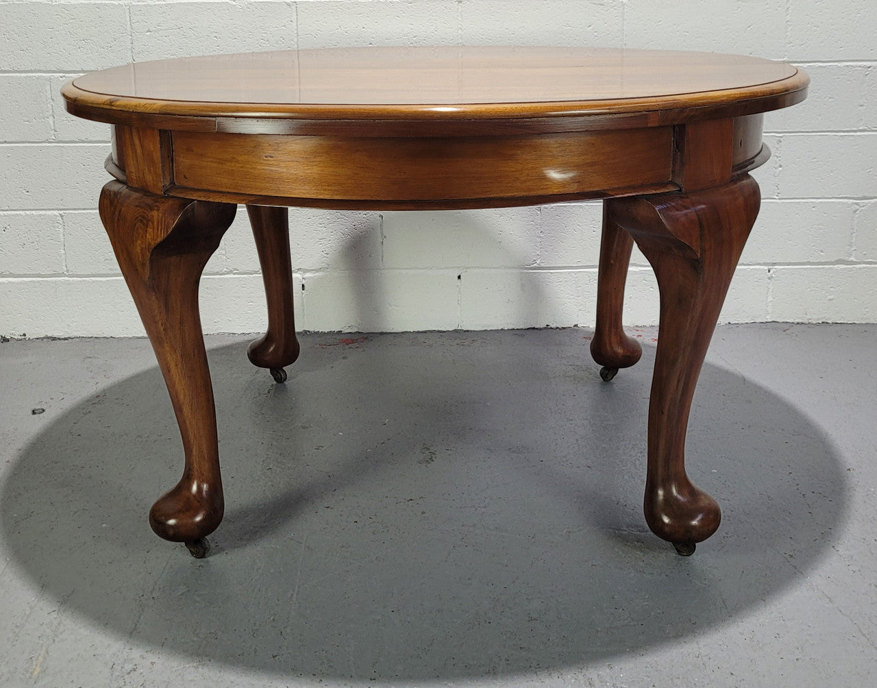 Period blackwood two leaf extension table. It can comfortably sit six people and eight when extend. It is in good original detailed condition.
