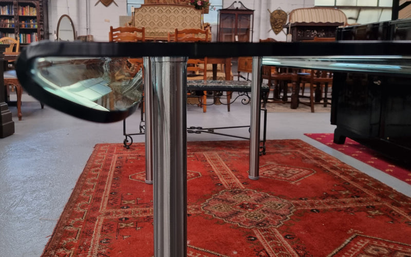 Striking and distinctive Vintage FIAM Italia Designer curved edge glass desk. FIAM was founded in 1973 by Vittorio Livio and has become synonymous with glass culture in Italy and the World. FIAM is still manufacturing today, in collaboration with various Designers, and has won numerous awards and is represented in various international museums. 
Condition: Evidence of use with minor scratches to the surface and a small chip that has been repaired. Overall, in very good condition with one repaired chip to t