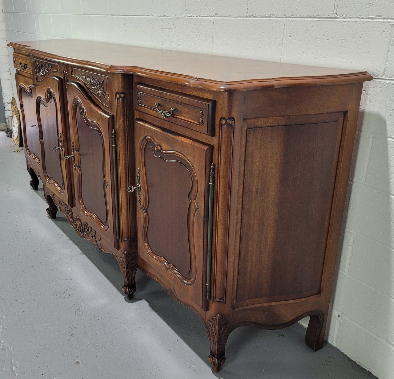Walnut Louis XV style parquetry top four door sideboard with beautiful carving. Plenty of storage space and it is in good original detailed condition.