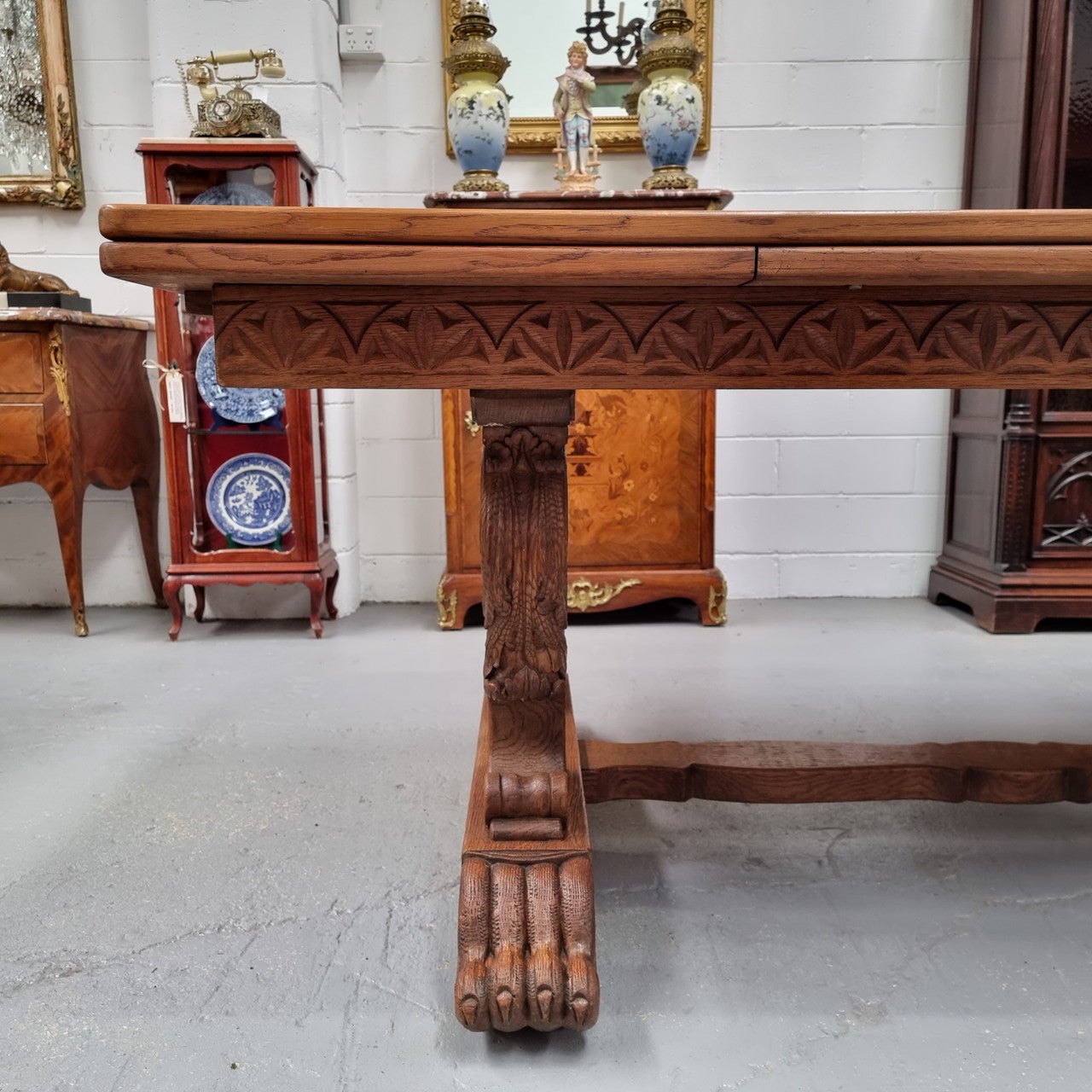 Amazing French Oak Renaissance style parquetry top extension table. Beautiful parquetry top and amazing detailed carvings on the legs. It extends to 306 cm long when fully extended. Sourced from France and in good original detailed condition.
