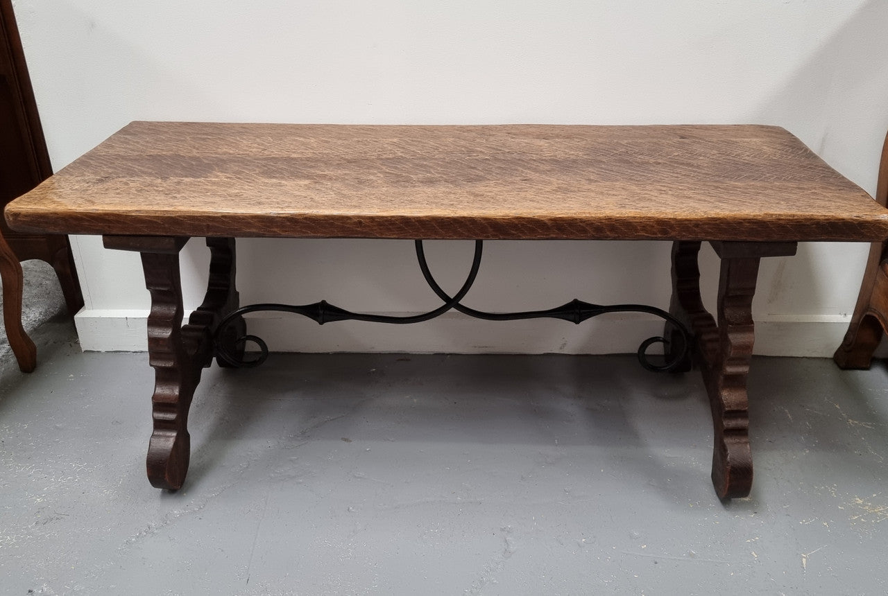 Charming French rustic Spanish style coffee table. It has an amazing rustic top and beautiful iron work. Sourced from France and is in good original detailed condition.