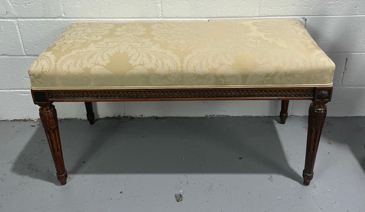 Nicely carved French Louis XVI style Walnut upholstered stool. The stool is in good condition and the frabic is in good used condition, please view photos as they help form part of the description.