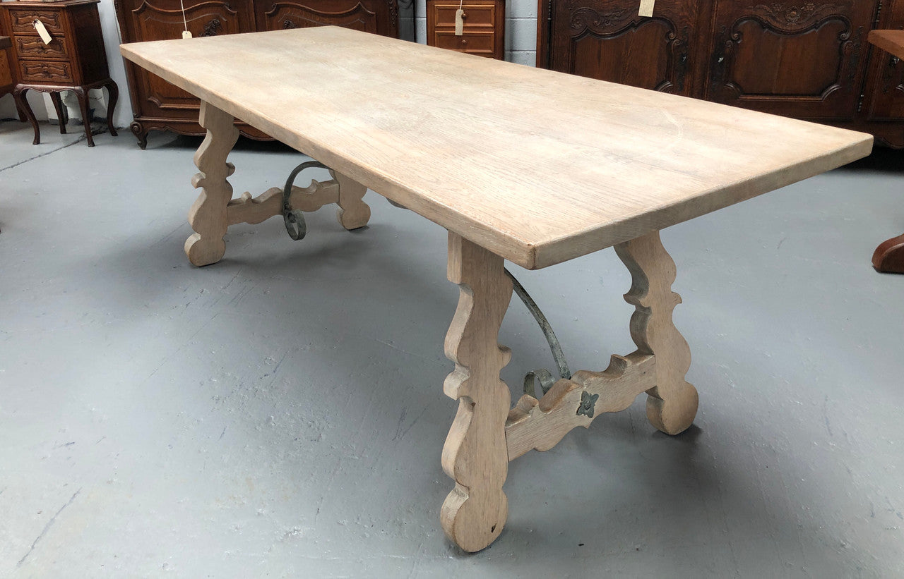Limed French Oak Farmhouse table with decorative iron base. In good original detailed condition.