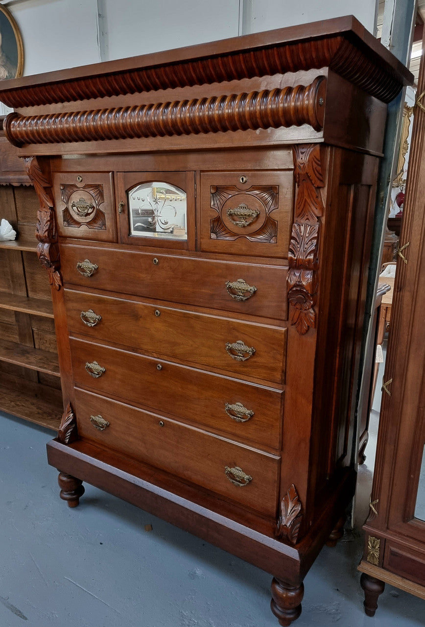 A 19th Century Scottish Mahogany tall boy/ chest of six drawers with small cabinet section at the top. Beautiful carvings and easily comes apart into three sections making transport for moving into place easy. In good original detailed condition.
