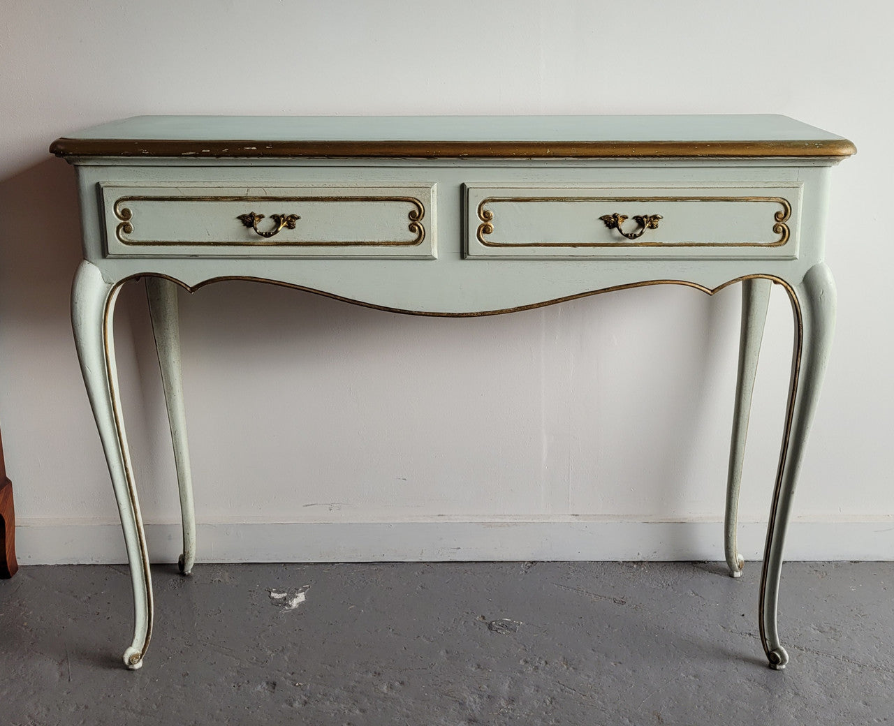 Vintage French Louis 15th style original painted and gilded highlights two drawer console table. It has been sourced from France and is in good original condition.
