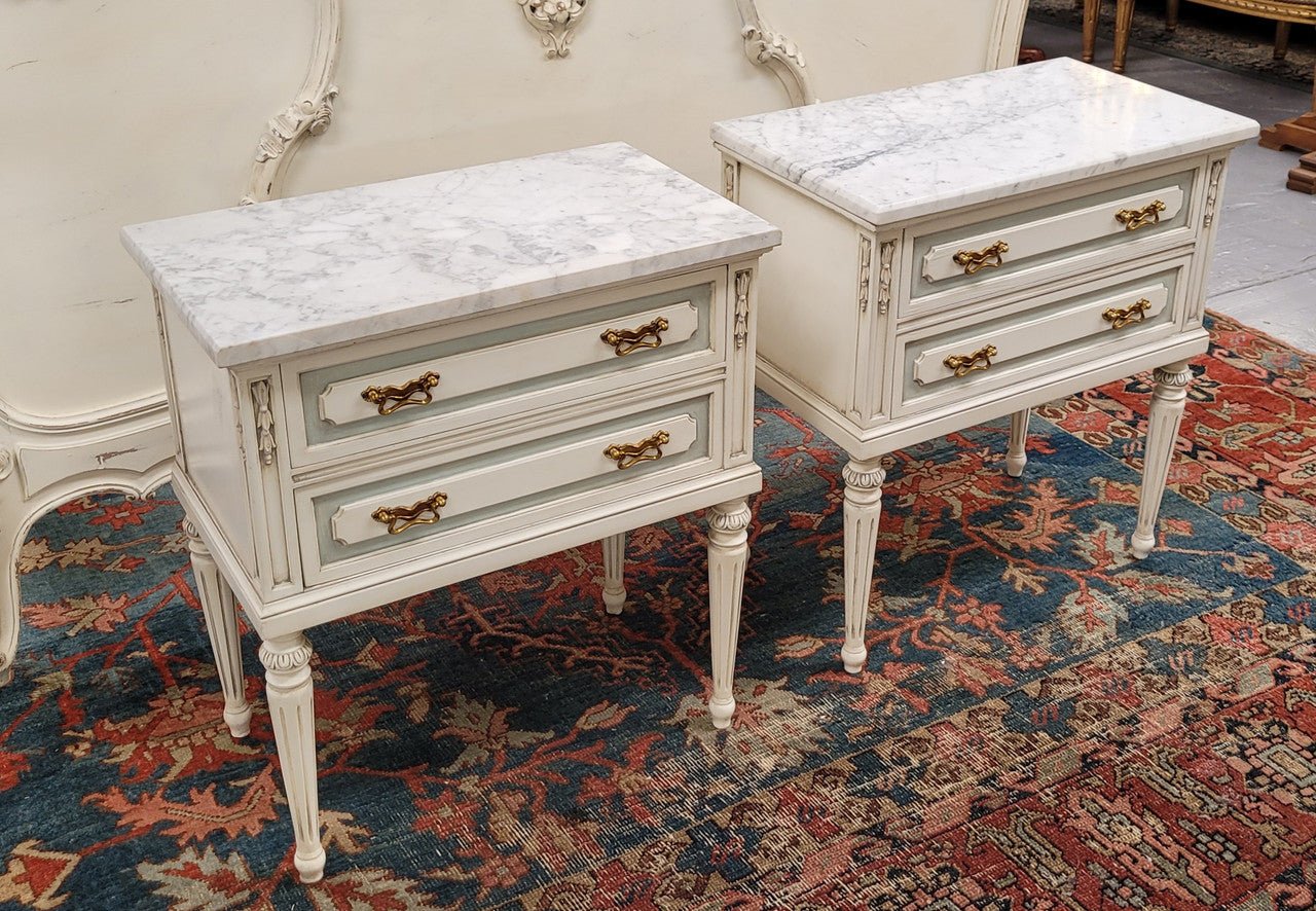 Attractive pair of Vintage French Louis 16th style two drawer marble topped bedsides. They have been sourced from France and are in good original condition.