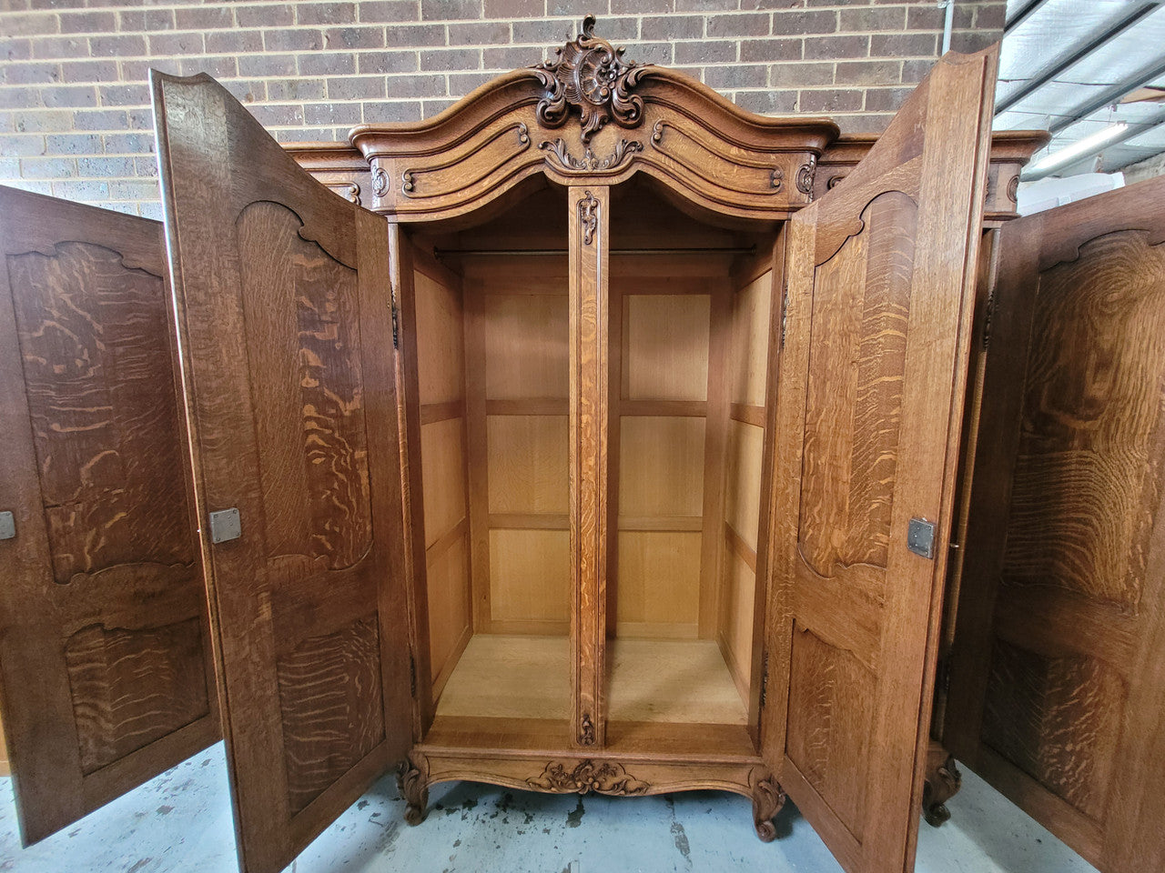 Amazing French Oak Louis XV style four door armoire. Plenty of storage space and beautifully carved throughout. In good original detailed condition and sourced from France. Please contact us for further photos.