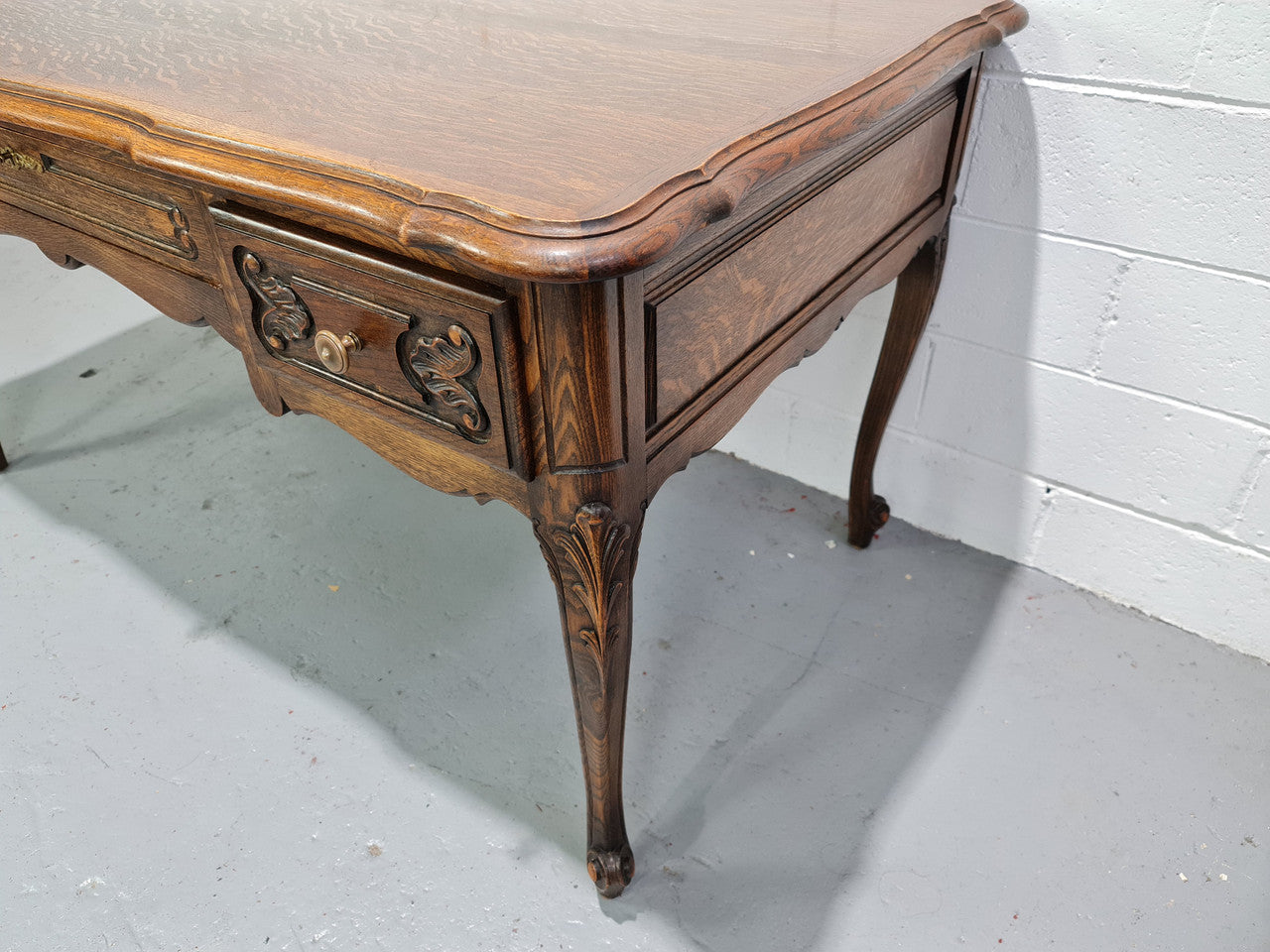 Attractive large Louis XV style Oak faux partners desk. Nicely carved details with three large functioning drawers, and three faux drawers at the back. In good original detailed condition.