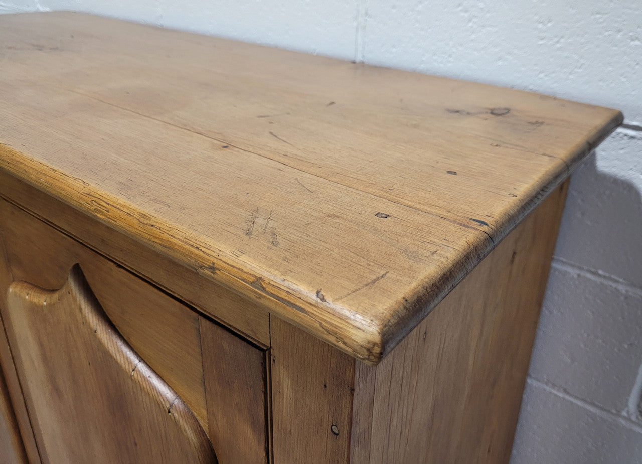 A lovely Victorian Pine shield cupboard with two doors and four shelves in good original detailed condition.