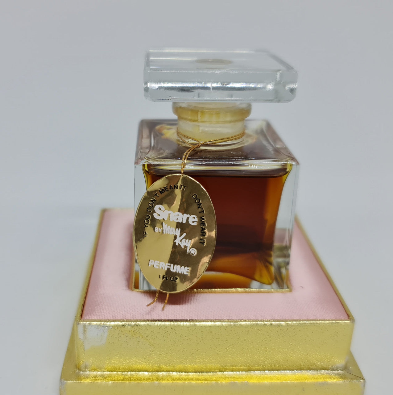 Beautiful Vintage snare "Mary Kay" French bottle of perfume. It is in amazing condition. Comes with pink and gold tray.