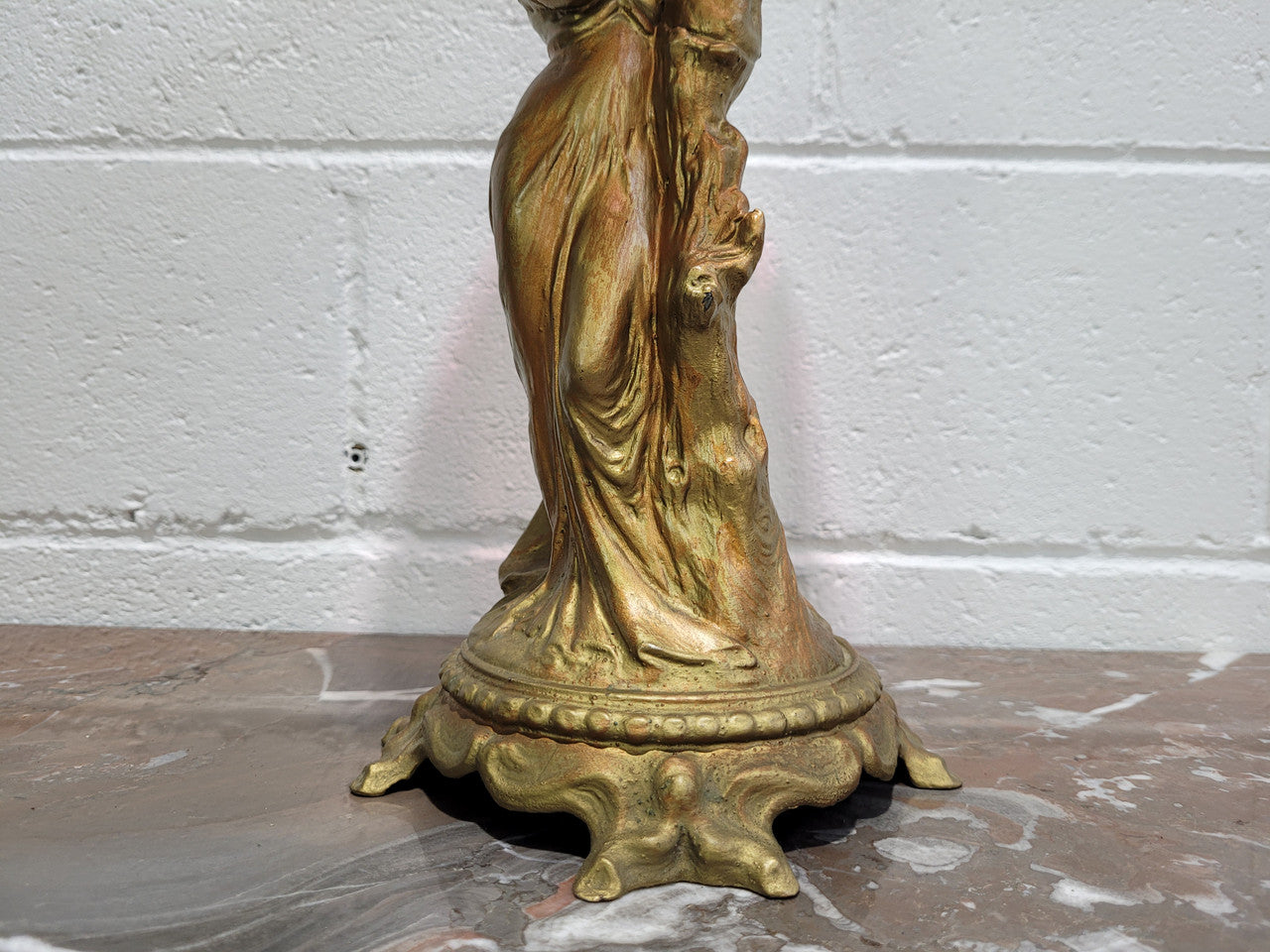 Late Victorian spelter table Centrepiece/comport featuring a woman holding an opalescent and ruby glass bowl. In good original condition with no damage to the ruby bowl.