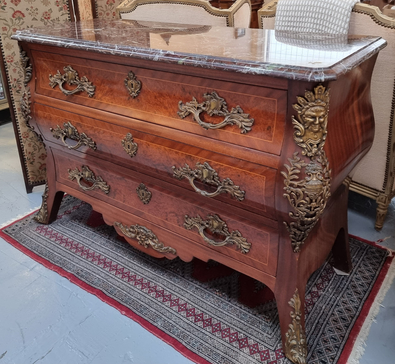 French Louis XVI style three drawer commode with amazing coloured marble. It has decorative brass mounts and is in very good original detailed condition.