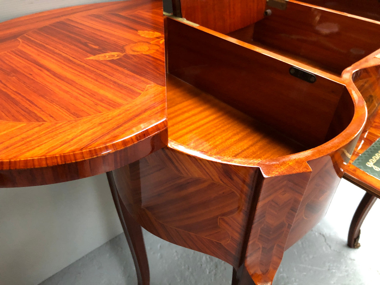 French Mahogany hidden dressing table with beautiful marquetry inlay. In good restored condition. Circa: 1950's
