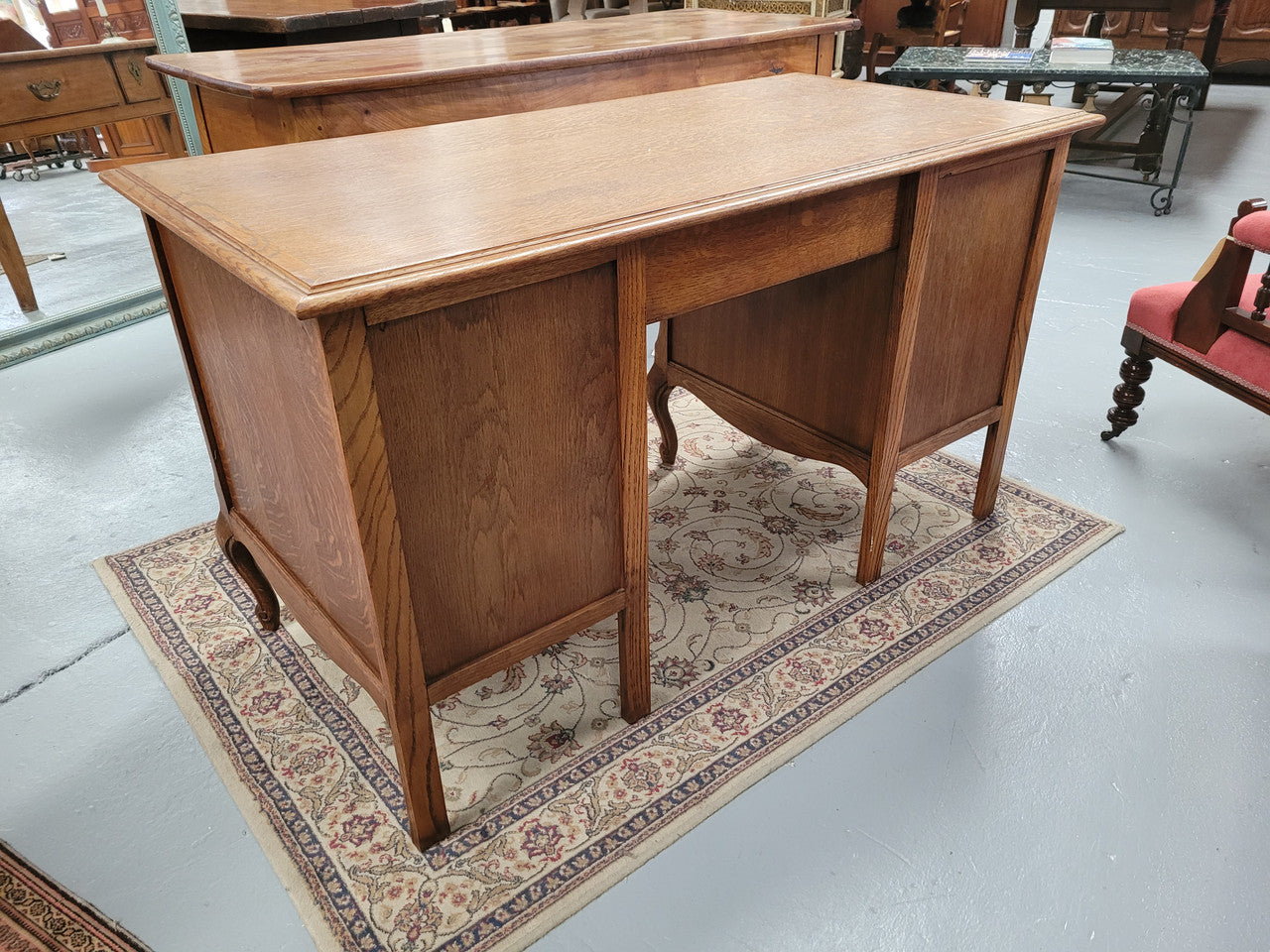 Beautifully carved French oak small desk with three drawers and a cupboard for all your storage needs. In good original condition. Great size for small spaces.