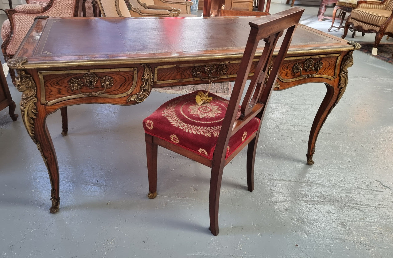 Beautifully fully restored French Antique Rosewood partners desk with beautiful ormolu detail and lovely tooled new leather top. There are three functioning drawers on one side for all your storage needs.