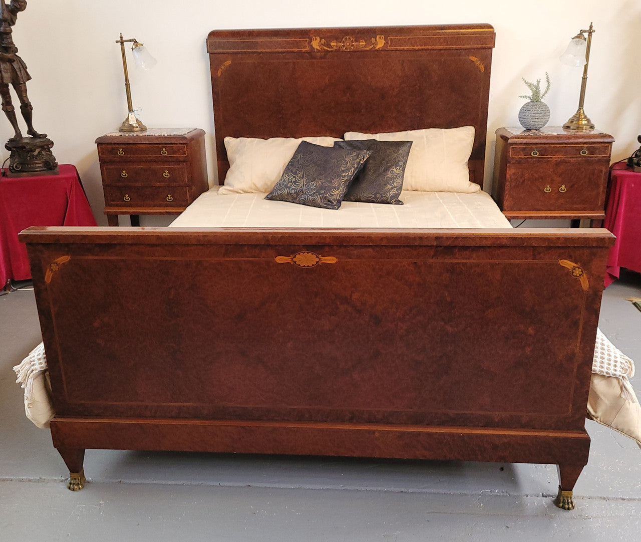 French Art Deco bedroom suite consisting of queen size bed in Amboyna wood and featuring pretty inlay. It comes with a matching pair of bedsides. It is a very stylish and high quality suite. It has been sourced from France and is in good original detailed condition.