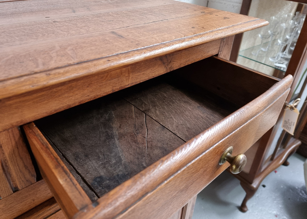 French Oak Early 19th Century sideboard with two doors and three drawers. In good original condition.