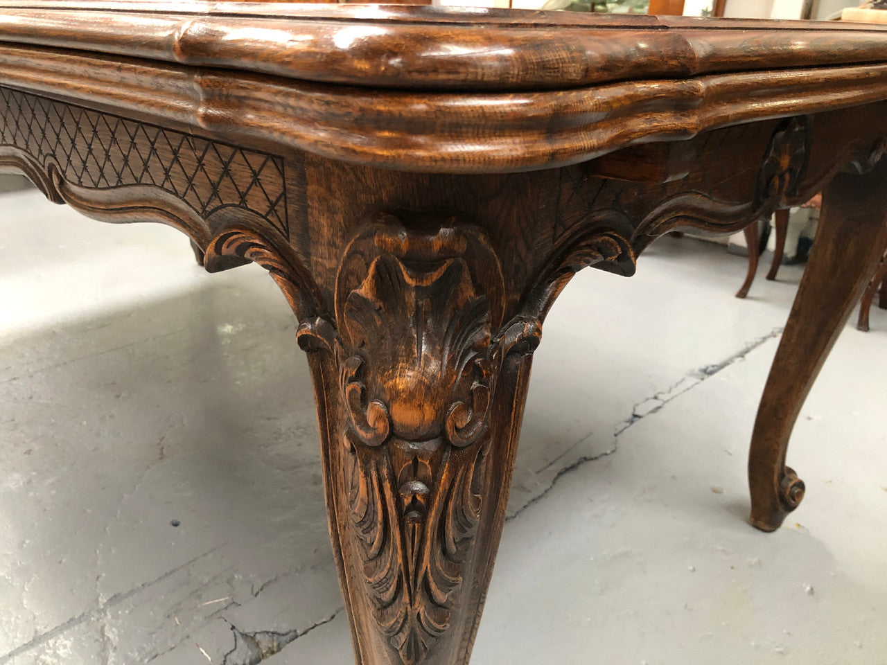 High quality French Oak Louis XV Style, beautifully carved extension table. It has an amazing parquetry top and when fully extended measures to 3 meters long. In very good original detailed condition.