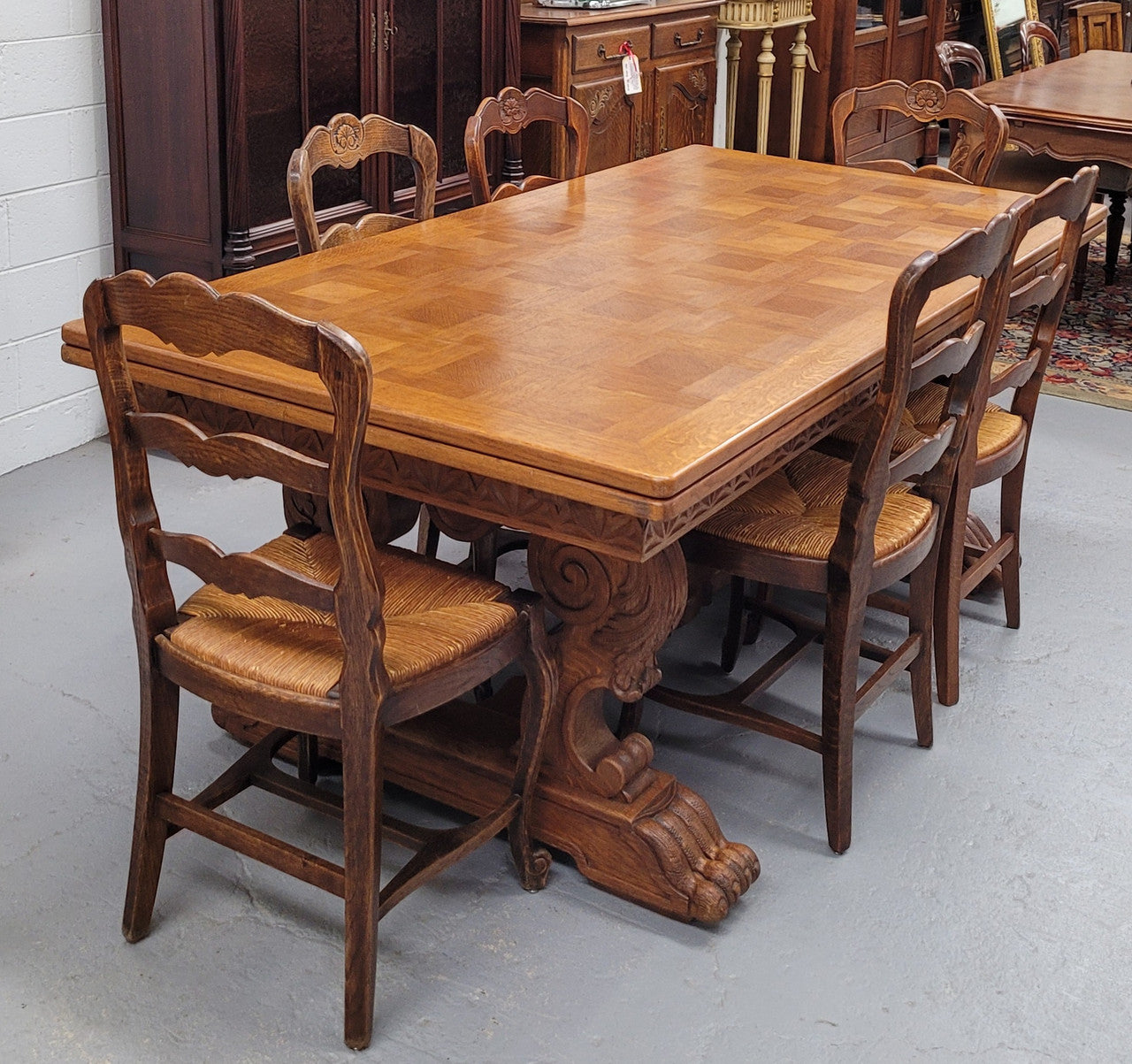 Amazing French Oak Renaissance style parquetry top extension table. Beautiful parquetry top and amazing detailed carvings on the legs. It extends to 306 cm long when fully extended. Sourced from France and in good original detailed condition.
