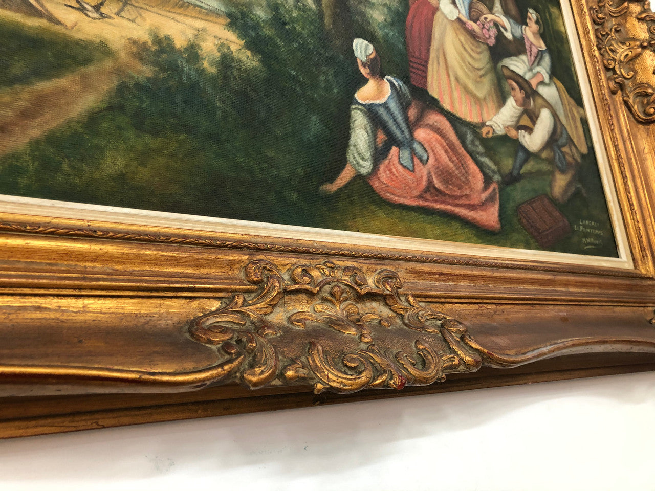 French "Romantic Scene" oil on board in a stunning gilt frame. It is signed and in very good detailed original condition.