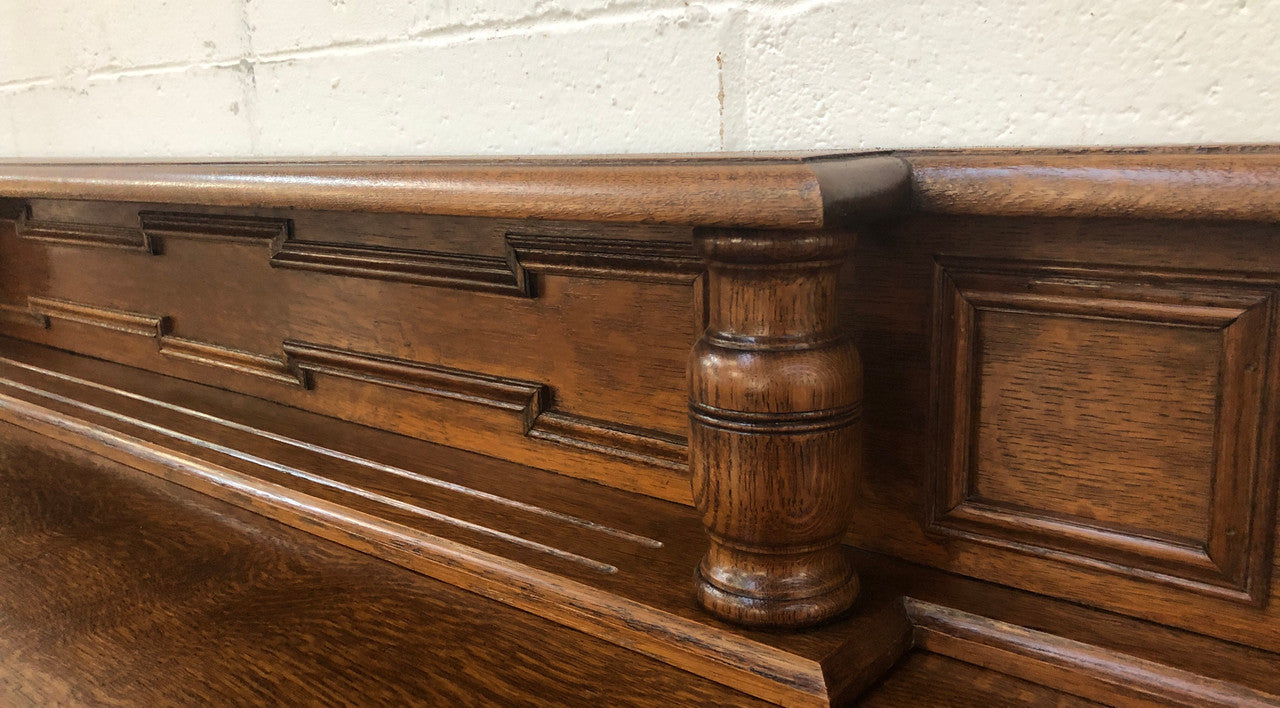 Beautiful carved French Oak four-door buffet with three drawers and lots of room for storage in good original detailed condition.