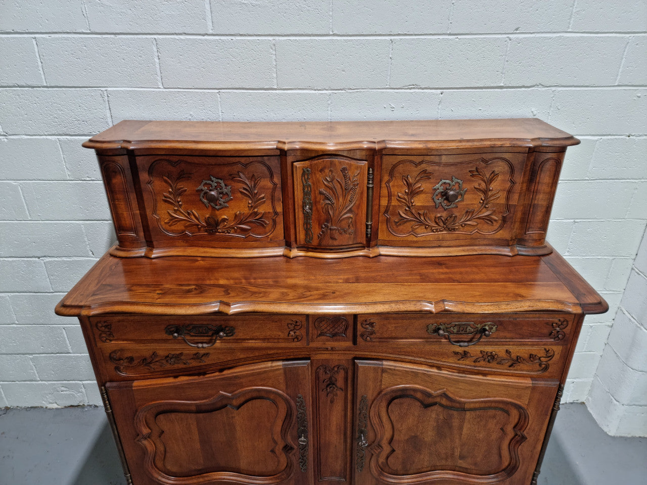 Stunning 19th Century French Walnut Buffet à Glissant from Provence, France. This is an exceptional charming piece and very functional with plenty of storage space, two large cupboards at the bottom, two drawers in the middle and two sliding doors either side at the top and finished off with a small central cupboard. In good original detailed condition.