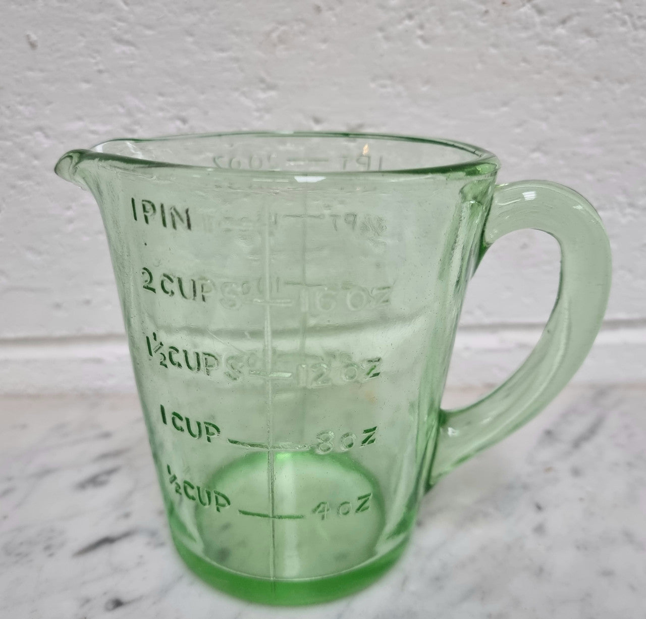 Vintage green depression glass jug. In good original condition.