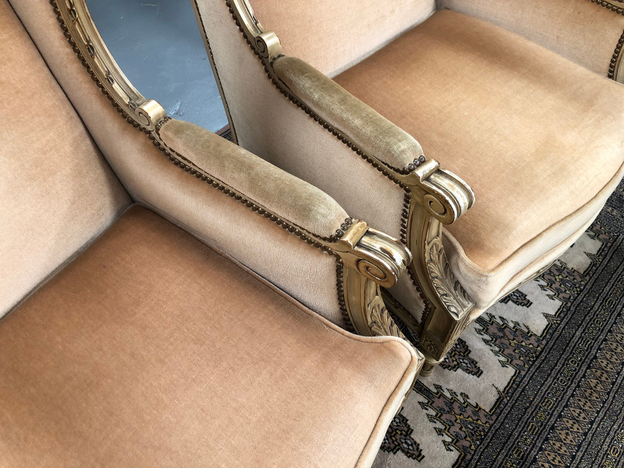 Pair of Vintage French original painted bergere wingback armchairs. The fabric is in very good original condition, please view photos as they help form part of the description. Please note the matching foot stool is being sold separately.