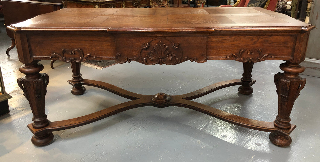Beautifully carved 19th century French oak Bureau Plat. With a lovely parquetry top and two drawers and decorative carved legs this piece is definitely one to look at . In good original detailed condition.