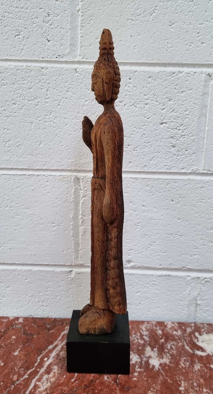 Antique Sukhothai Style Thai carving of a standing Buddha. In good original detailed condition.