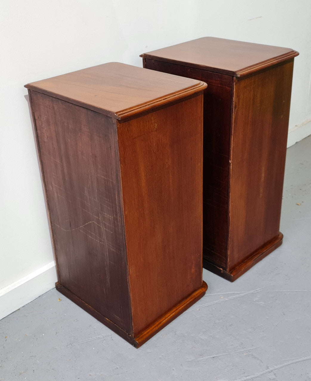 Pair of English Victorian Mahogany bedside drawers. In good original detailed condition.