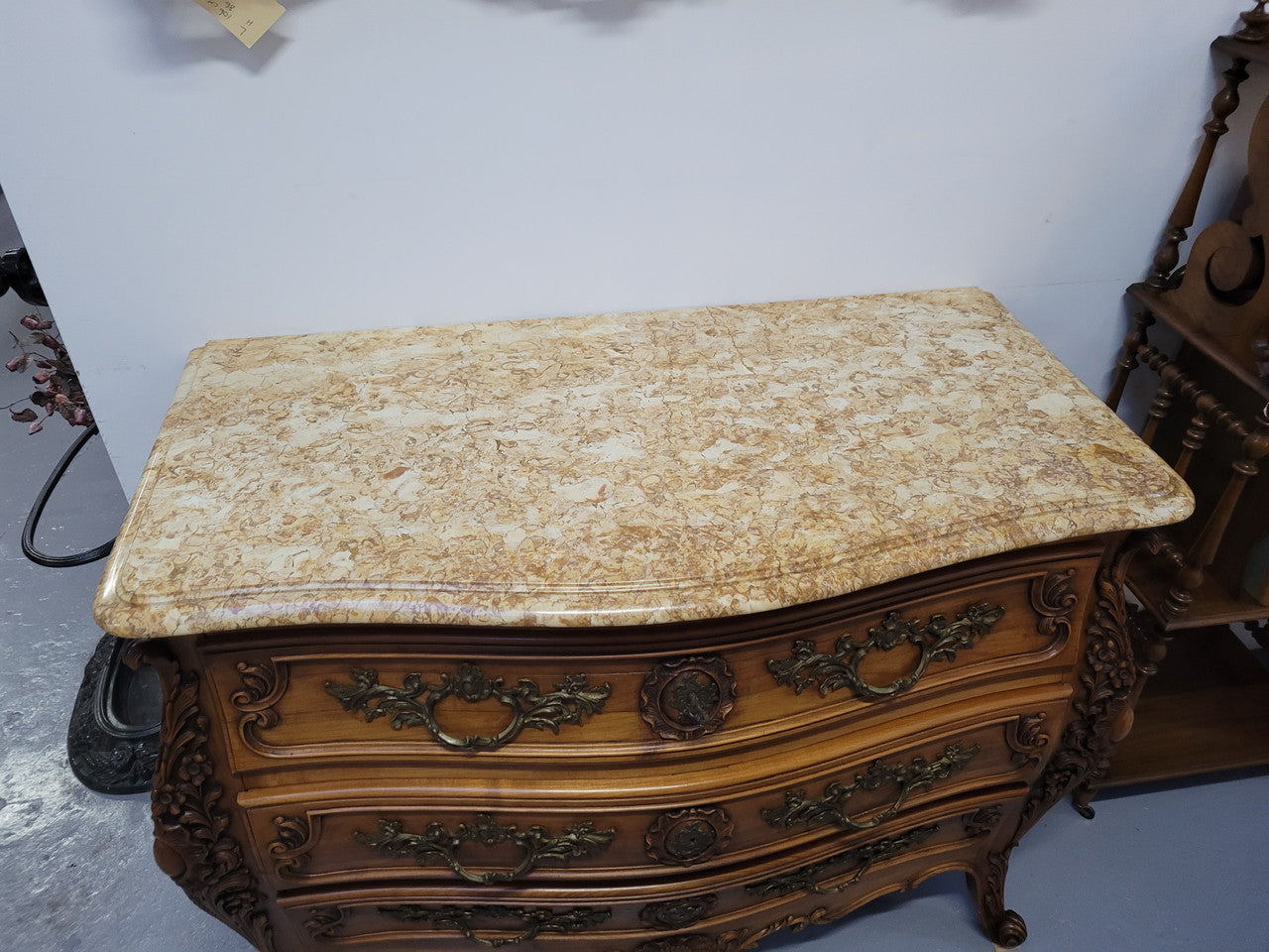 Impressive Louis XV style three drawer walnut commode. Ormolu handles and bevelled marble top complimenting detailed carving. In very good original detailed condition.