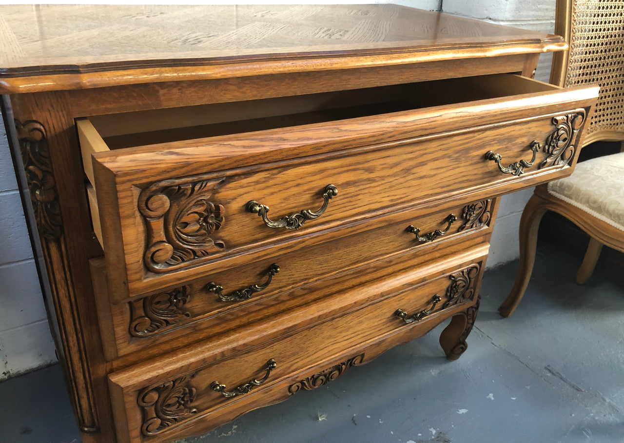 Gorgeous Provincial oak and parquetry top commode. It has beautiful carved Details and in good original detailed condition.