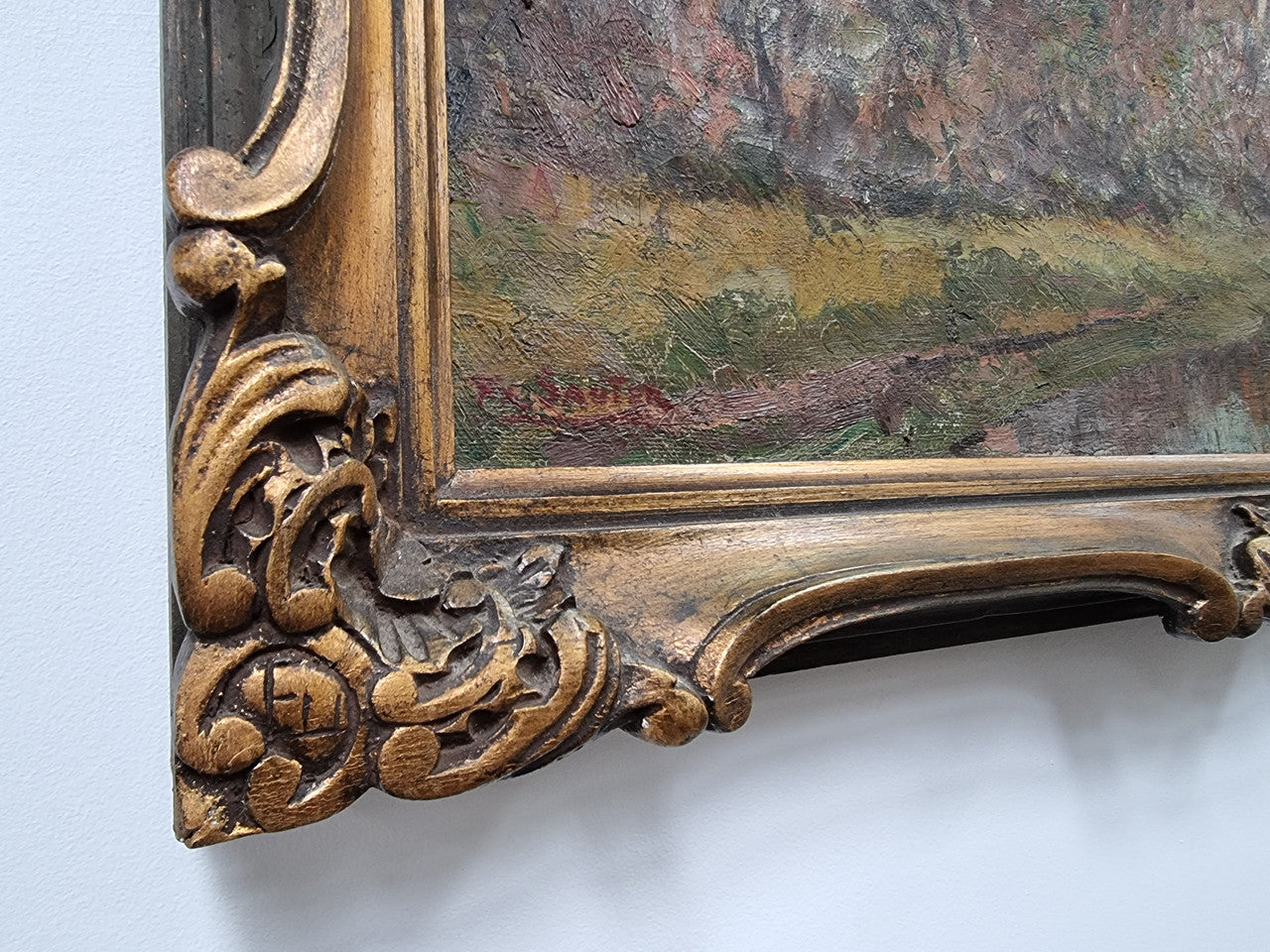 French signed country scene oil on canvas in a lovely decorative frame. In good original condition.