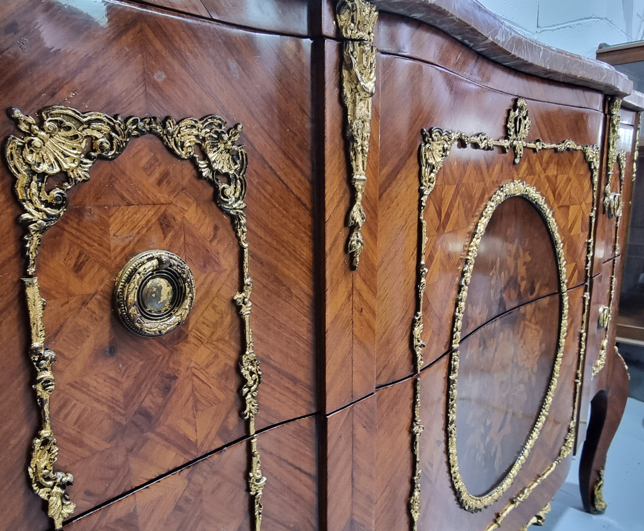 Stunning Louis XV style ormolu and marquetry marble top commode with two drawers. It has an amazing thick marble top and it is in good original detailed condition.